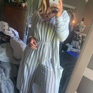 White stripped jump suit and cardigan